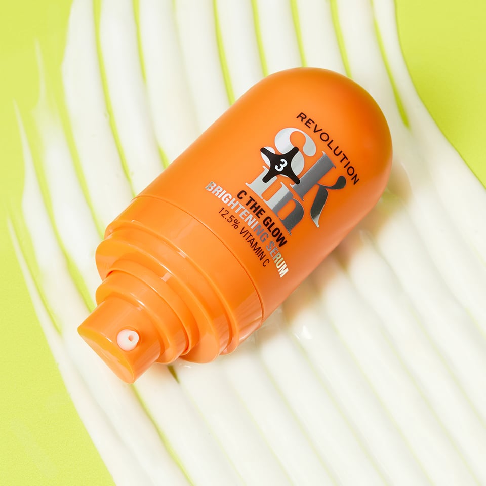 An image of a hand holding the Revolution Skincare x Sali Hughes Must-C Anytime Daily Serum