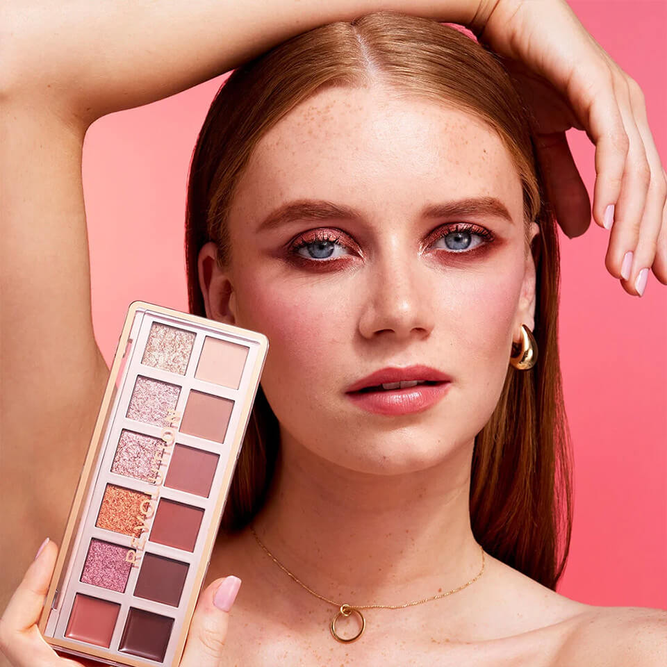 A photo of a model holding the Revolution True Icon Palette
