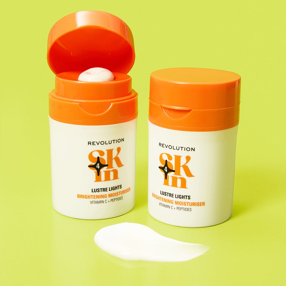 An image of a hand pouring the Revolution Skincare 5% Glycolic Acid Toner on to a cotton pad